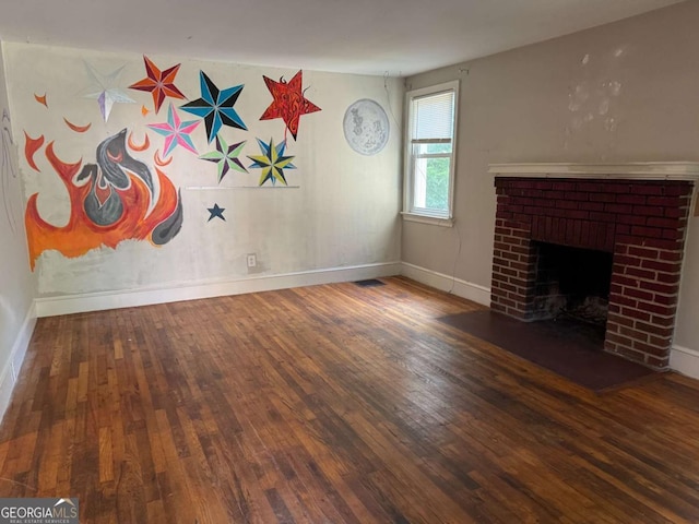 520 Holman Ave, Athens, GA 30606 - unfurnished living room featuring hardwood / wood-style floors and a brick fireplace