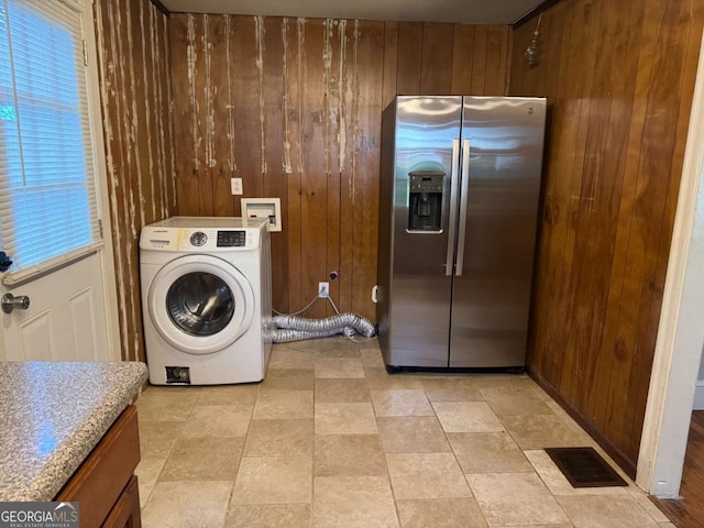 520 Holman Ave, Athens, GA 30606 - laundry area featuring washer / clothes dryer, wood walls, and cabinet space