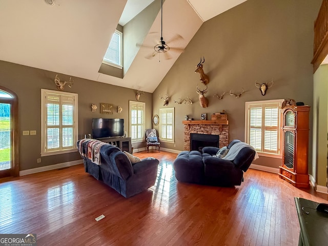 1940 Horne Rd, Eastman, GA 31023 - living area with wood finished floors, a fireplace, a ceiling fan, and high vaulted ceiling