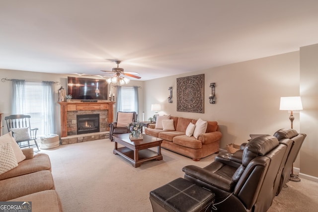 53 Denny Ln, Dallas, GA 30157 - living room featuring light colored carpet, plenty of natural light, a stone fireplace, and a ceiling fan