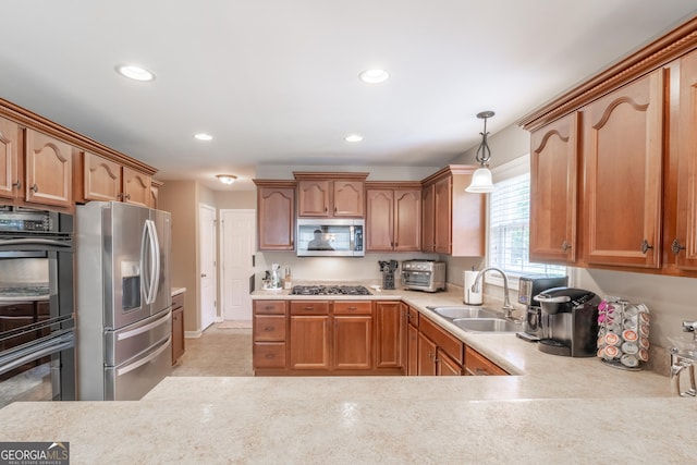 53 Denny Ln, Dallas, GA 30157 - kitchen featuring stainless steel appliances, light countertops, recessed lighting, and hanging light fixtures