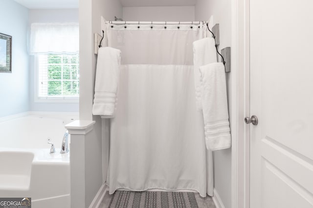 53 Denny Ln, Dallas, GA 30157 - bathroom featuring a garden tub and a shower with curtain