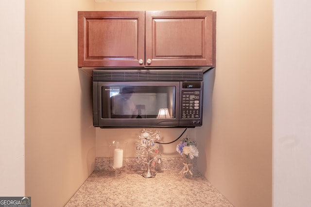 53 Denny Ln, Dallas, GA 30157 - detailed view of black microwave and light countertops