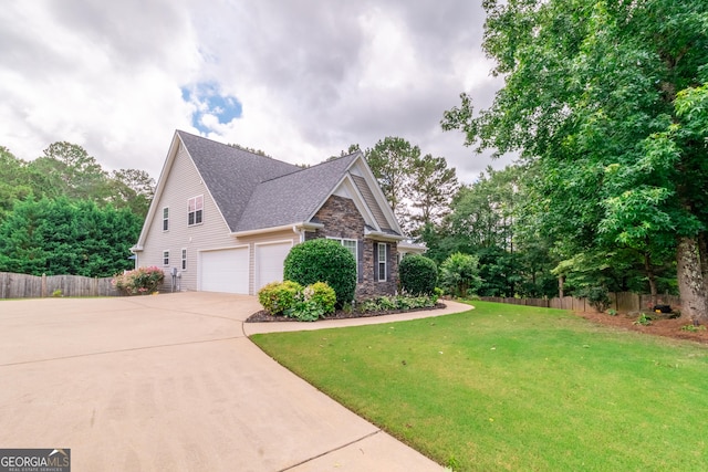 53 Denny Ln, Dallas, GA 30157 - view of front of house with driveway, stone siding, a shingled roof, and an attached garage