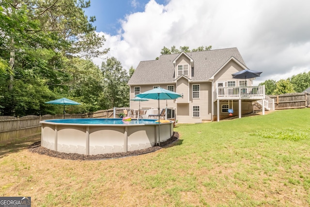 53 Denny Ln, Dallas, GA 30157 - back of property featuring a deck, stairway, a fenced backyard, and roof with shingles