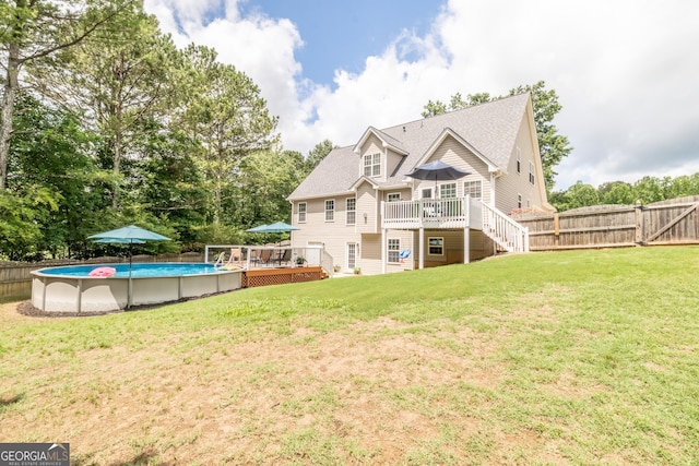 53 Denny Ln, Dallas, GA 30157 - back of property with a deck, an outdoor pool, and stairs