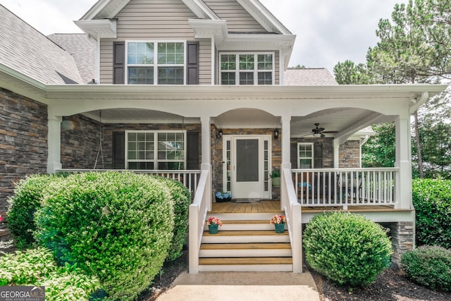 53 Denny Ln, Dallas, GA 30157 - view of front of home with a ceiling fan, stone siding, a porch, and a shingled roof