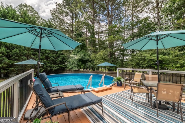53 Denny Ln, Dallas, GA 30157 - view of swimming pool featuring view of wooded area and a wooden deck