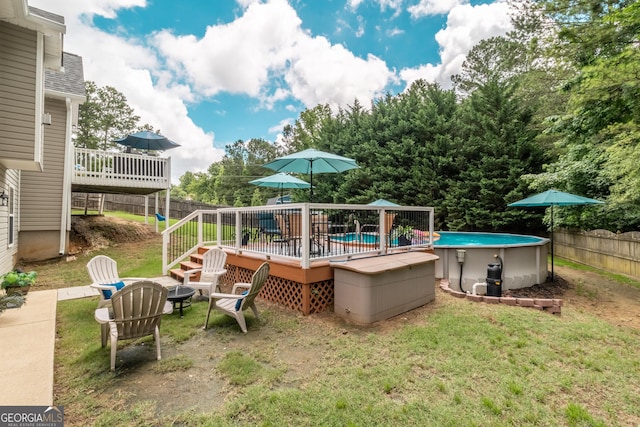 53 Denny Ln, Dallas, GA 30157 - fenced yard featuring a deck, an outdoor pool, and an outdoor fire pit