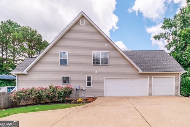 53 Denny Ln, Dallas, GA 30157 - view of side of home featuring driveway, roof with shingles, and an attached garage