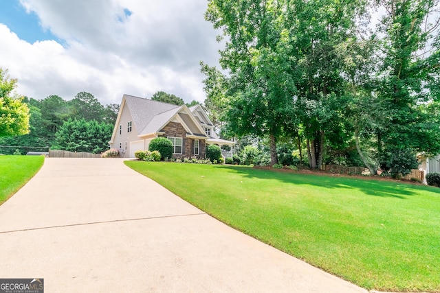 53 Denny Ln, Dallas, GA 30157 - view of side of home with driveway, stone siding, and an attached garage
