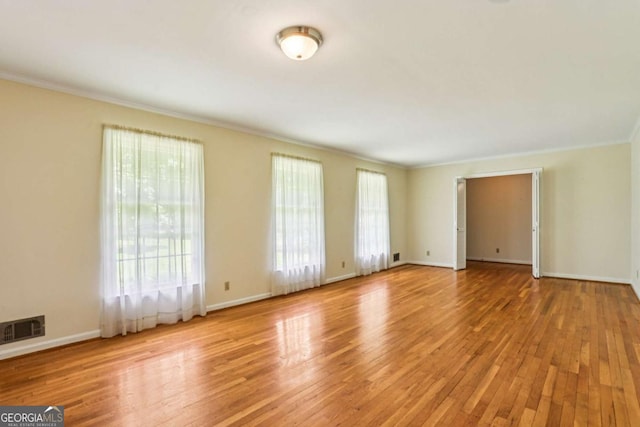 415 Haven Ln, Marietta, GA 30066 - spare room with crown molding and light wood-style floors