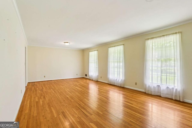 415 Haven Ln, Marietta, GA 30066 - spare room featuring crown molding and light wood-style floors