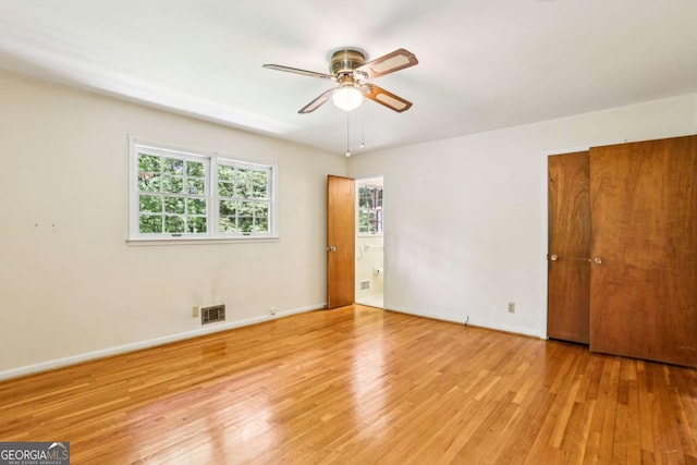 415 Haven Ln, Marietta, GA 30066 - unfurnished bedroom with wood finished floors and connected bathroom