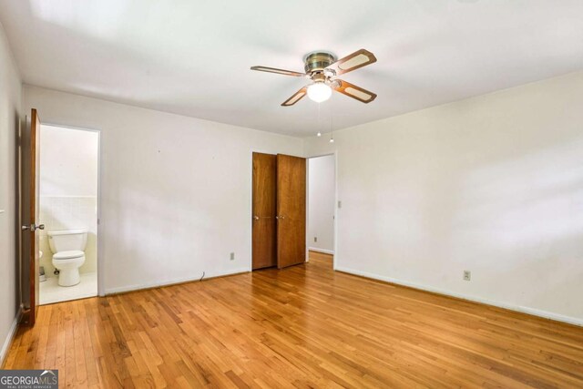 415 Haven Ln, Marietta, GA 30066 - unfurnished bedroom featuring light wood-style floors and ensuite bath