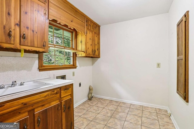 415 Haven Ln, Marietta, GA 30066 - laundry area with washer hookup, cabinet space, light tile patterned floors, and electric dryer hookup