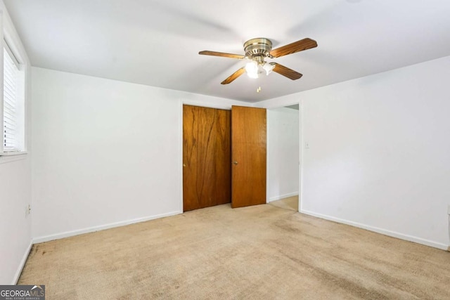 415 Haven Ln, Marietta, GA 30066 - unfurnished bedroom with light carpet, a closet, and a ceiling fan