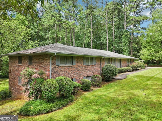 415 Haven Ln, Marietta, GA 30066 - view of property exterior with a yard and brick siding