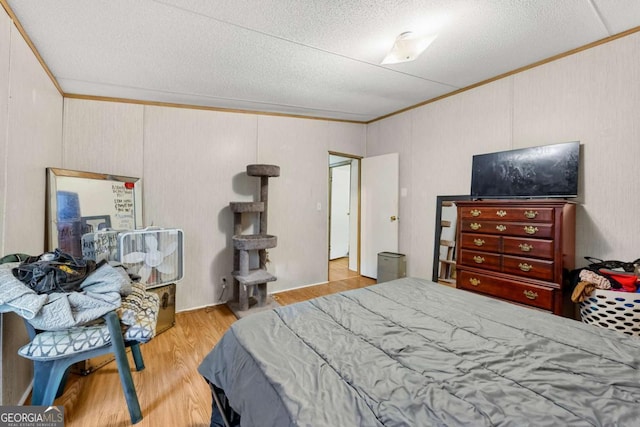 203 Shaw St, Rincon, GA 31326 - bedroom with crown molding, a textured ceiling, and wood finished floors