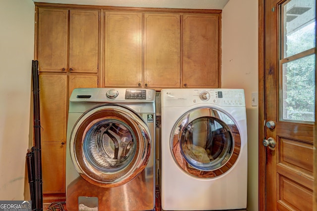 5739 Cobb Mdw, Norcross, GA 30093 - laundry room featuring washing machine and clothes dryer and cabinet space