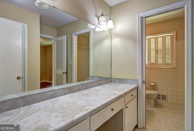 5739 Cobb Mdw, Norcross, GA 30093 - bathroom with vanity, tile walls, and tile patterned flooring