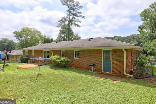 5739 Cobb Mdw, Norcross, GA 30093 - back of property with brick siding and a lawn