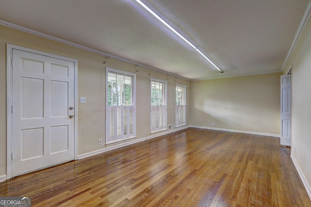 5739 Cobb Mdw, Norcross, GA 30093 - unfurnished room with wood finished floors and crown molding