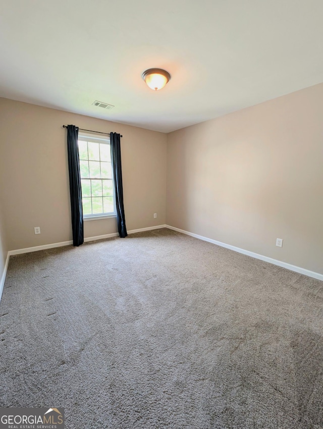 1581 Shetland Pony Ct NW, Suwanee, GA 30024 - carpeted empty room with baseboards