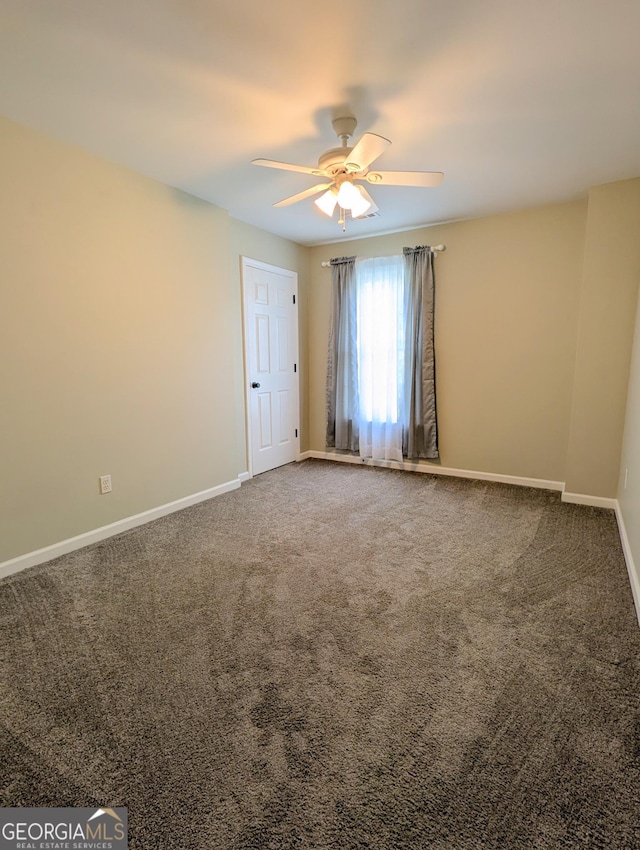 1581 Shetland Pony Ct NW, Suwanee, GA 30024 - spare room with ceiling fan and carpet floors