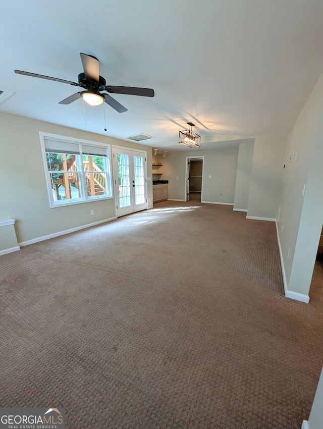 1581 Shetland Pony Ct NW, Suwanee, GA 30024 - carpeted empty room with a ceiling fan and french doors