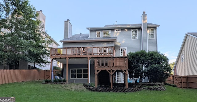 1581 Shetland Pony Ct NW, Suwanee, GA 30024 - back of property with a wooden deck, a fenced backyard, and a chimney