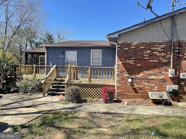 1008 E 12th St, West Point, GA 31833 - view of front of home featuring a deck and brick siding
