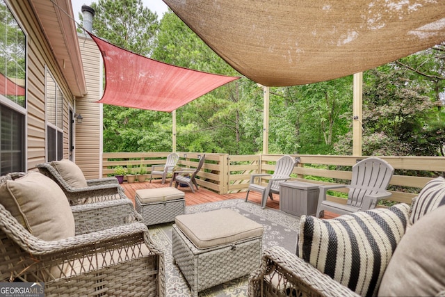 1248 Rockview Ct, Loganville, GA 30052 - view of patio / terrace with a wooden deck, an outdoor living space, and view of scattered trees