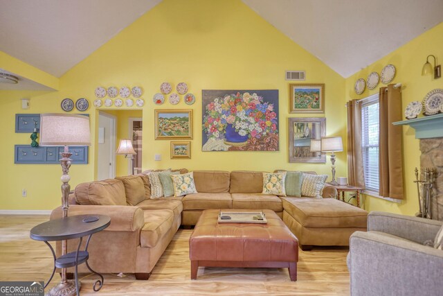 1248 Rockview Ct, Loganville, GA 30052 - living room featuring high vaulted ceiling and wood finished floors