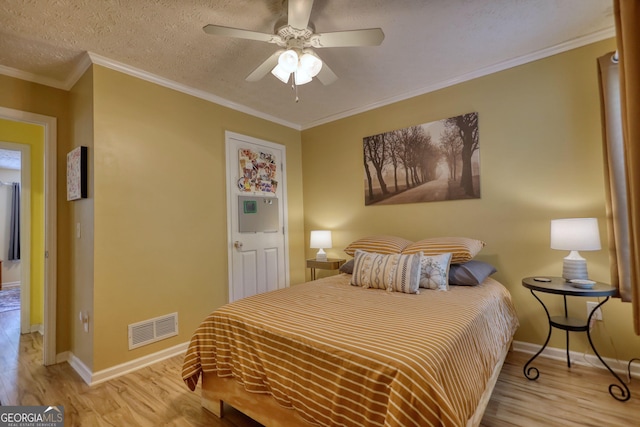 1248 Rockview Ct, Loganville, GA 30052 - bedroom featuring light wood-style flooring, ceiling fan, ornamental molding, and a textured ceiling