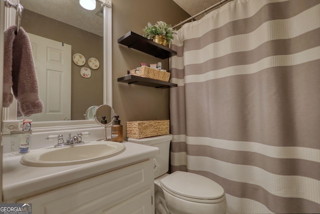 1248 Rockview Ct, Loganville, GA 30052 - full bathroom with vanity, a textured ceiling, and a shower with shower curtain