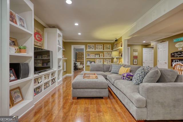 1248 Rockview Ct, Loganville, GA 30052 - living area featuring crown molding, recessed lighting, and light wood-type flooring