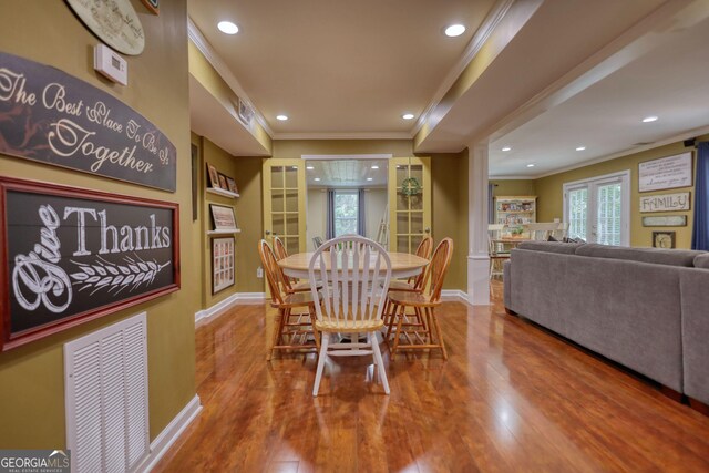 1248 Rockview Ct, Loganville, GA 30052 - dining area featuring ornamental molding, wood finished floors, recessed lighting, and french doors