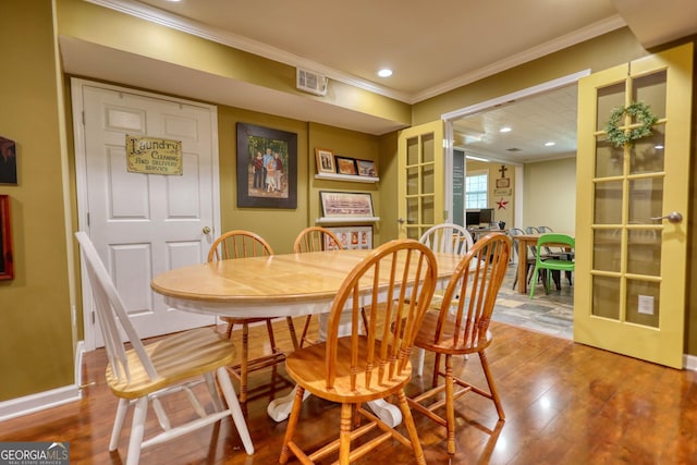 1248 Rockview Ct, Loganville, GA 30052 - dining space with ornamental molding, wood-type flooring, french doors, and recessed lighting