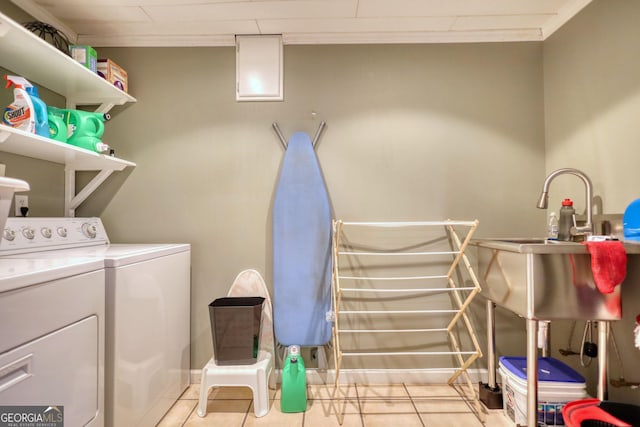 1248 Rockview Ct, Loganville, GA 30052 - washroom featuring washing machine and clothes dryer and light tile patterned floors