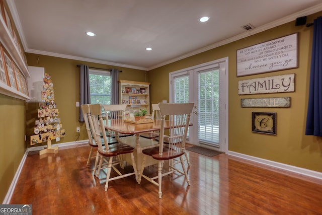 1248 Rockview Ct, Loganville, GA 30052 - dining space with wood finished floors, ornamental molding, and recessed lighting