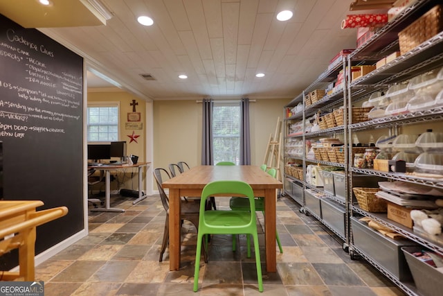 1248 Rockview Ct, Loganville, GA 30052 - dining area featuring recessed lighting, ornamental molding, plenty of natural light, a desk, and stone finish floors
