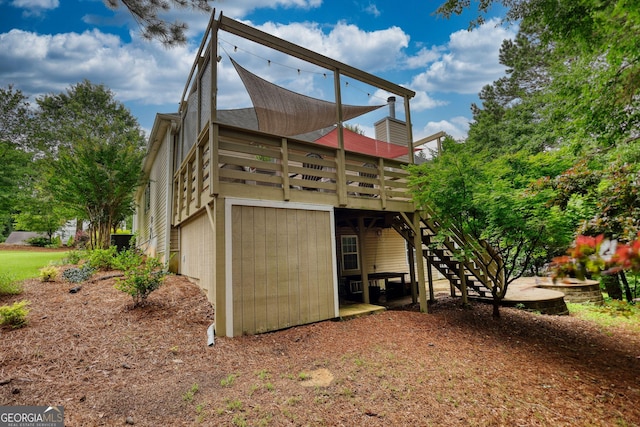 1248 Rockview Ct, Loganville, GA 30052 - back of property with stairway and a deck