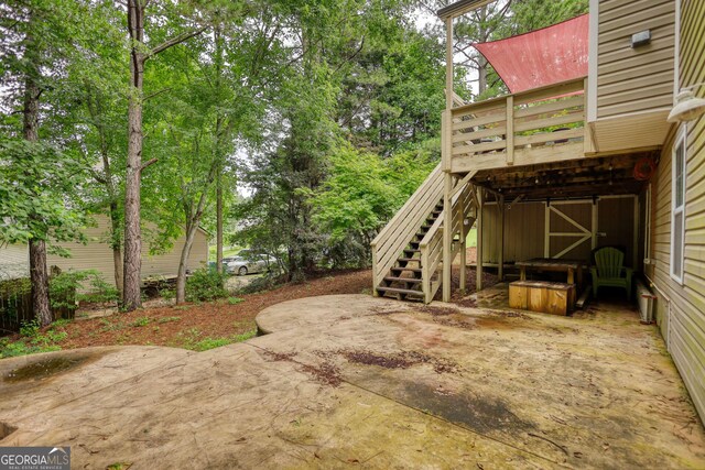 1248 Rockview Ct, Loganville, GA 30052 - view of yard featuring stairs, a patio, and a wooden deck