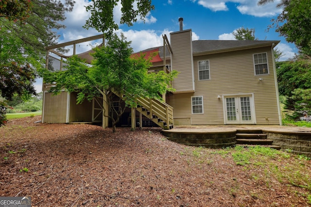 1248 Rockview Ct, Loganville, GA 30052 - rear view of property with french doors, stairway, a chimney, and a patio