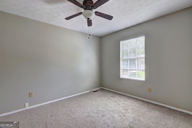 5026 Brittany Dr, Stone Mountain, GA 30083 - carpeted spare room with a textured ceiling and a ceiling fan