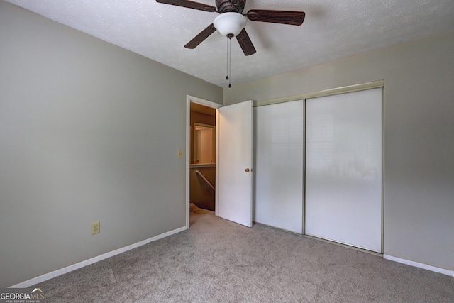 5026 Brittany Dr, Stone Mountain, GA 30083 - unfurnished bedroom with carpet floors, a closet, and ceiling fan