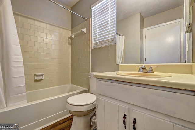 5026 Brittany Dr, Stone Mountain, GA 30083 - full bath featuring shower / bath combo, wood finished floors, and vanity