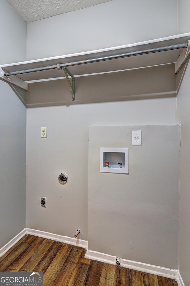 5026 Brittany Dr, Stone Mountain, GA 30083 - laundry area with electric dryer hookup, hookup for a gas dryer, washer hookup, and wood finished floors