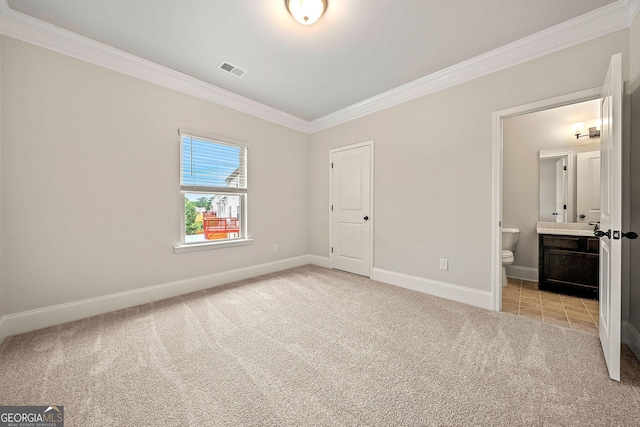 3865 Rifflepool Ct, Douglasville, GA 30135 - unfurnished bedroom featuring ornamental molding, light colored carpet, and ensuite bathroom